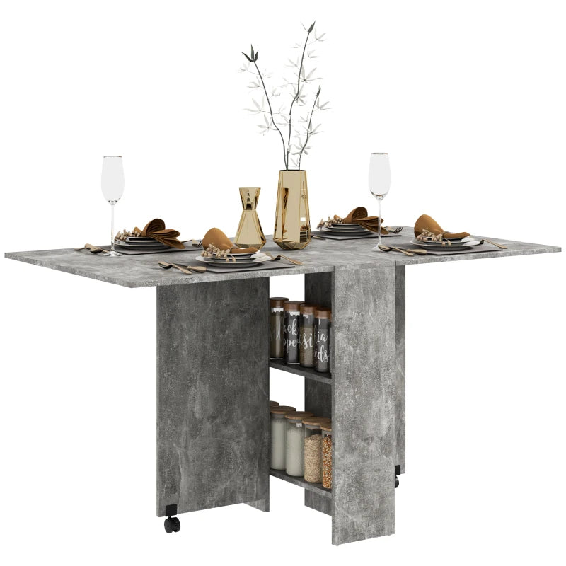 HOMCOM Folding Dining Table, Drop Leaf Table for Small Spaces with 2-tier Shelves, Small Kitchen Table with Rolling Casters, Cement Grey